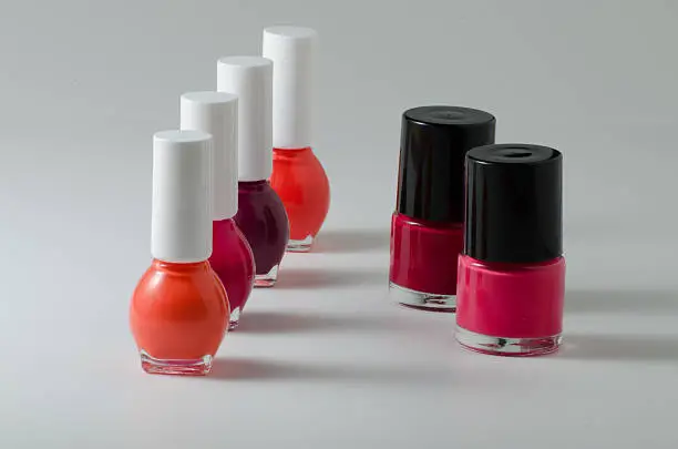 Simple isolated photo of nail polish,red one