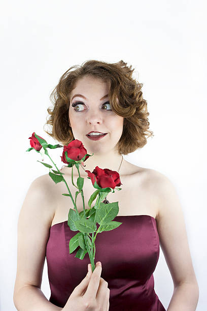 Pretty young woman with red roses
