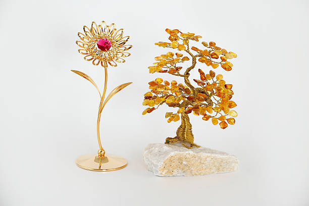 istock Amber bonsai and gold flower 486239555