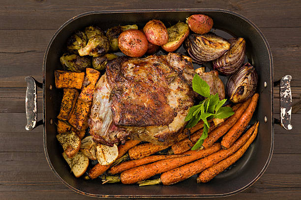 istock Roasted Leg Of Lamb And Vegetables 486243217