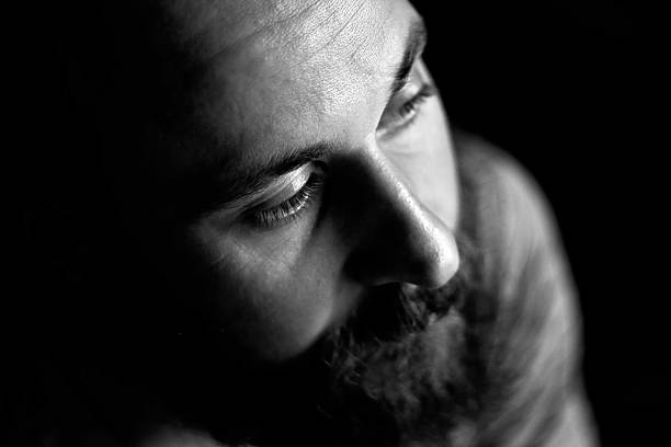 istock Black and white portrait of a serious man, top view 486247710