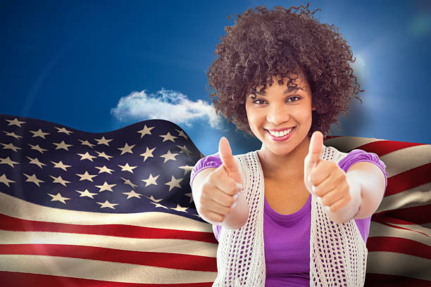Composite image of smiling woman showing thumbs up