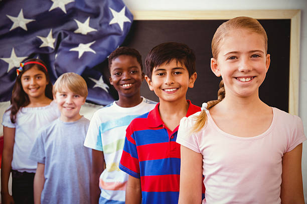 istock Composite image of smiling little school kids 486249690
