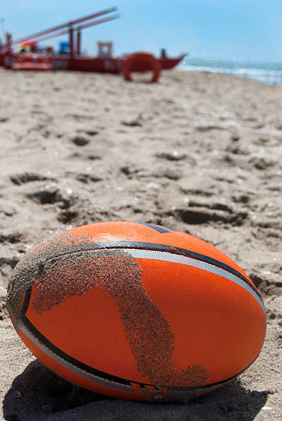 istock rugby ball on the beach 486253126