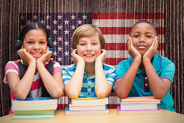 istock Composite image of cute pupils looking at camera 486253232