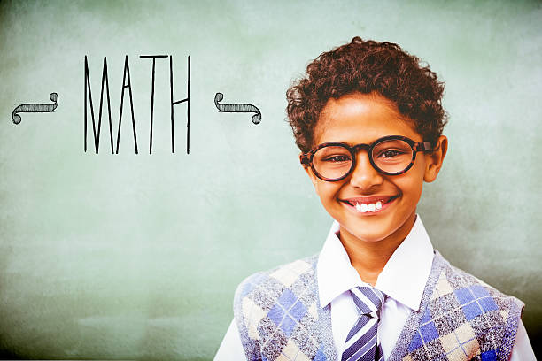 istock Math against cute little boy smiling in classroom 486253934