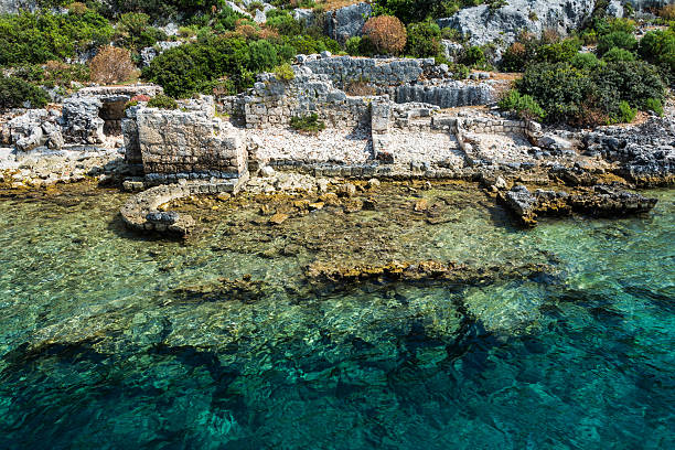 The ancient Lycian sunken city of Simena, Kekova Simena is a popular Lycian site, situated upon one of the most attractive spots of the Turkish coast.  The name "Kekova" is Turkish for "plain of thyme" and describes the region  kekova stock pictures, royalty-free photos & images