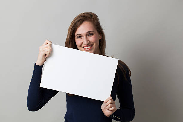 istock cheerful 20s woman enjoying making an advertisement 486254862