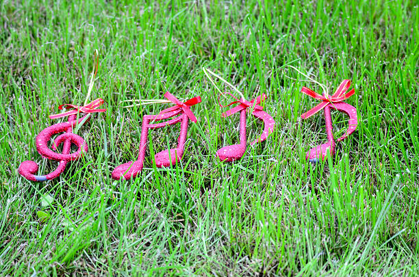 istock Xmas music notes on a green grass background 486255046