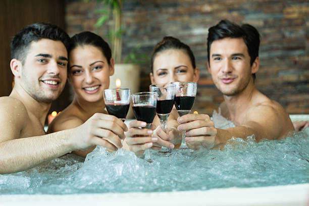istock Friends toasting in hot tub 486258653