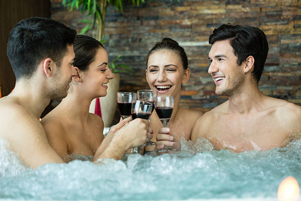 istock Friends toasting in hot tub 486258655