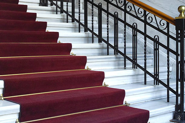 istock Red Carpet On The White Stairs 486258974
