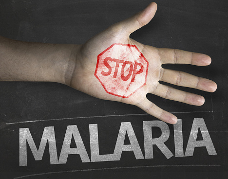 Educational and Creative composition with the message Stop Malaria on the blackboard