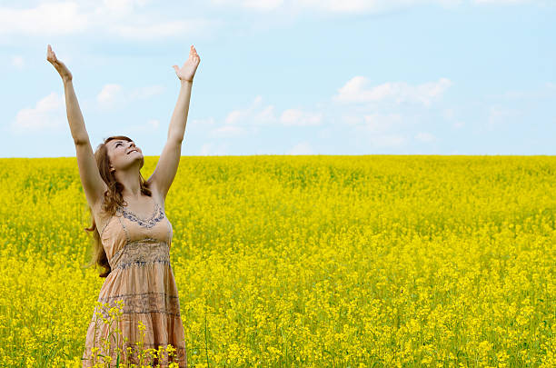 istock Young woman at canola field 486260271