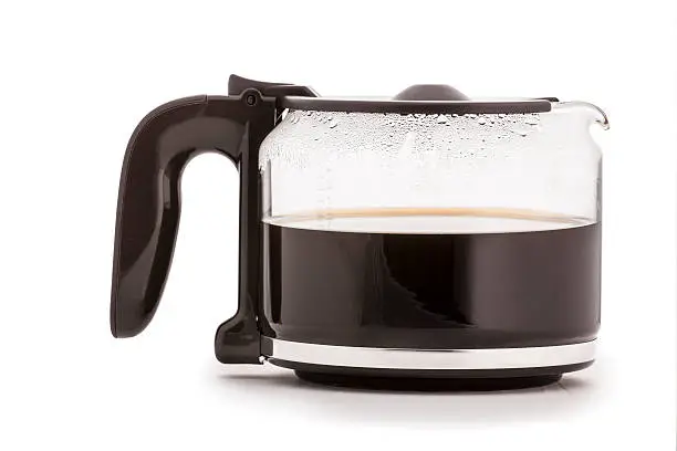 close up of a half  full Coffee Carafe on white background