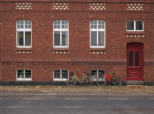 Front view of a red row house in Greifswald, Mecklenburg-Vorpommern, Germany.