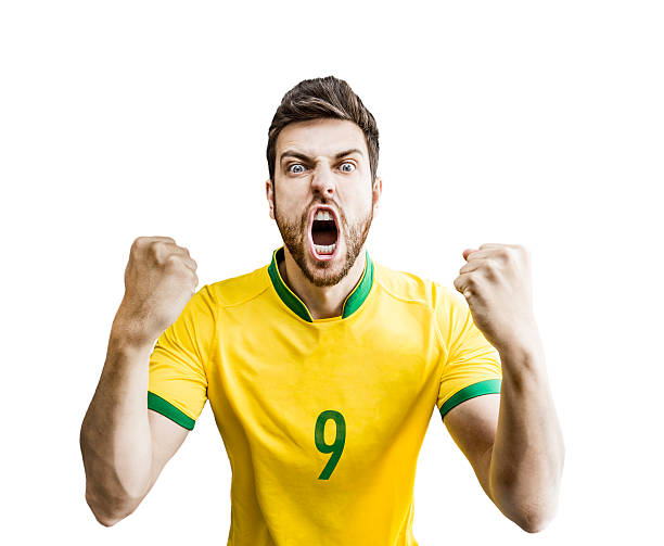 istock Brazilian fan celebrates isolated on white background 486262991