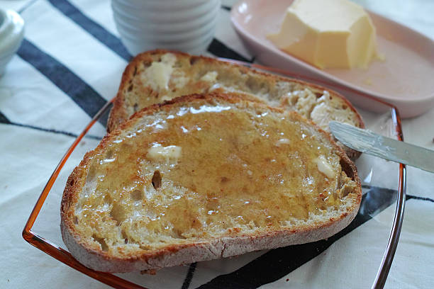 istock Bread With Butter And Honey Ready For Breakfast 486263280