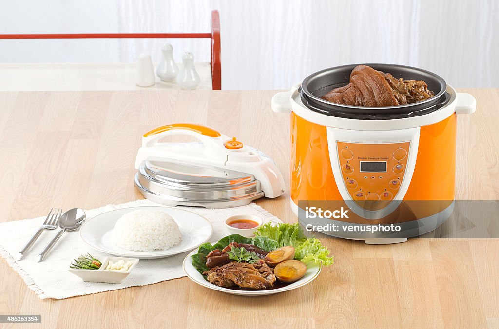 Electric pressure cooker Electric pressure cooker new technology for cooking Boiler Stock Photo