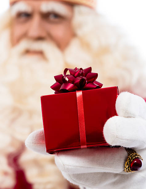 istock Santa Claus showing gift 486263426