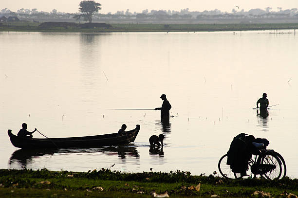 istock Fisherman Silhouette near U Bein bridge. 486263657
