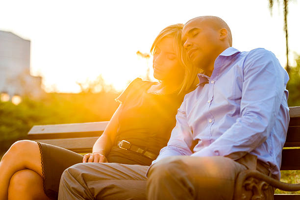 An Older Couple Sitting on a Bench