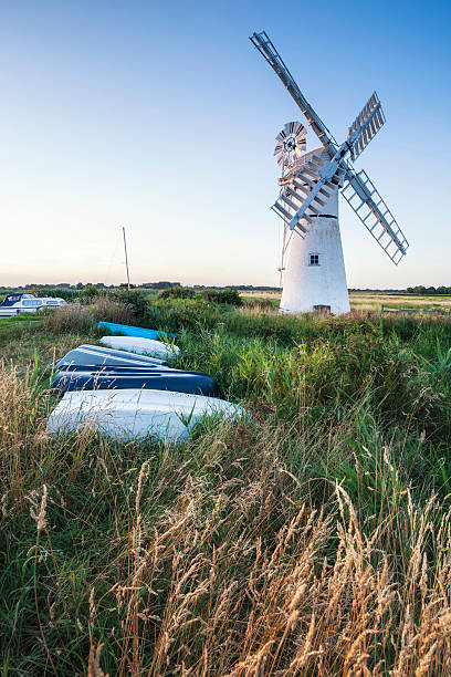 istock Stunning landscape of windmill and river at dawn 486268280
