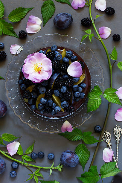istock Chocolate cake with icing, blackberries and blueberries. 486271932