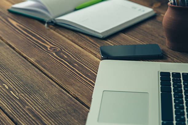 istock Laptop and diary on the desk 486272536