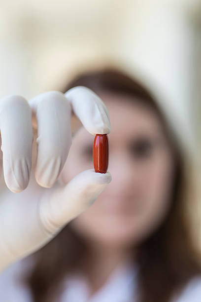 istock Doctor holding red pill capsule 486272856