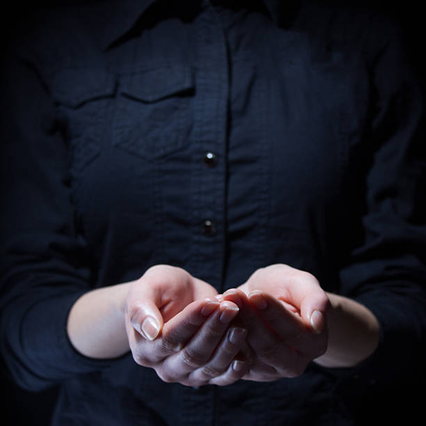 istock female hands holding showing or giving something 486274592