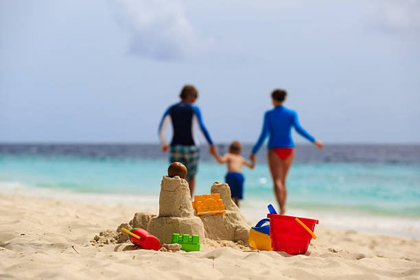 istock sand castle on tropical beach, family vacation 486275322