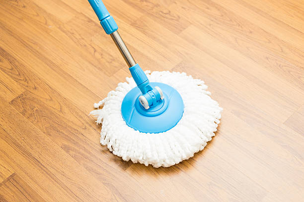 istock Cleaning wood floor by modern mop. 486278908