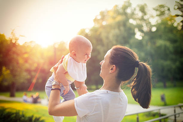istock mother with baby in the park 486280510