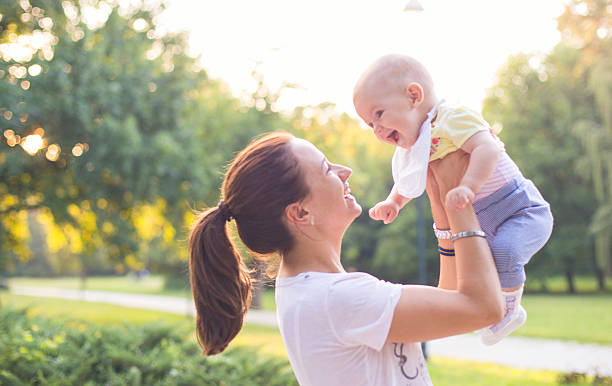 istock mother with baby in the park 486280540