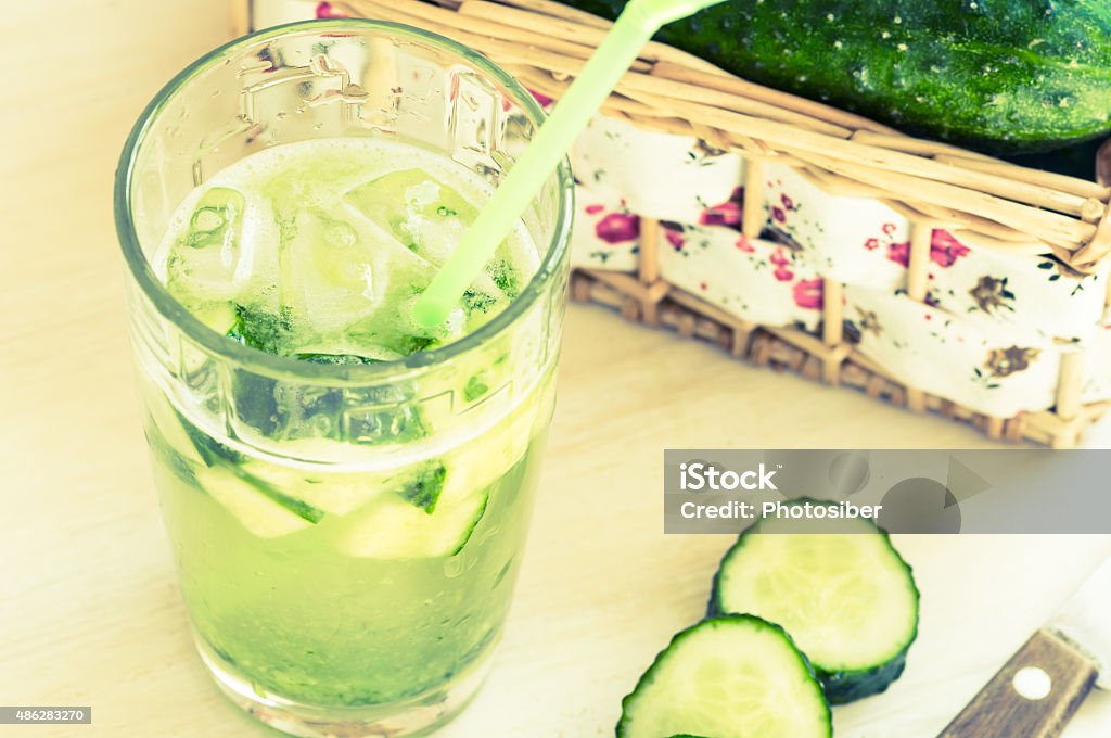 Cucumber drink with ice in a glass Cucumber drink with ice in a glass on table 2015 Stock Photo