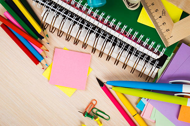 istock School and office accessories on wooden background 486283384