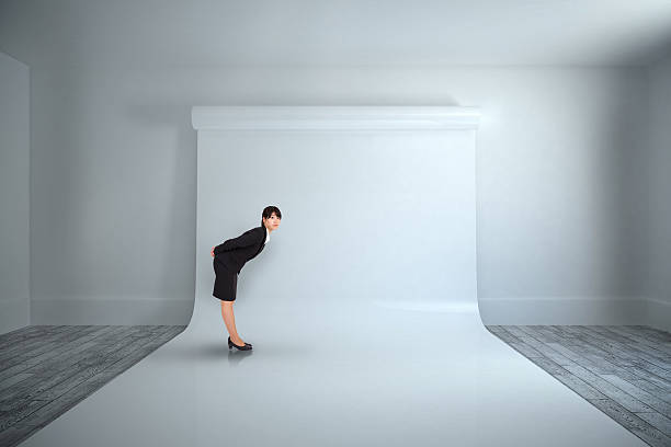 istock Composite image of serious businesswoman bending 486283736