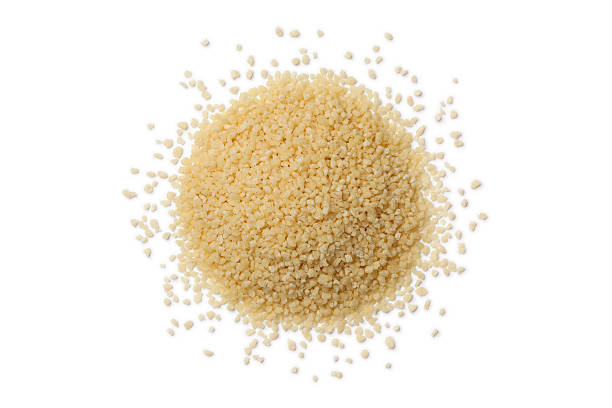 istock Heap of raw couscous grains 486283858
