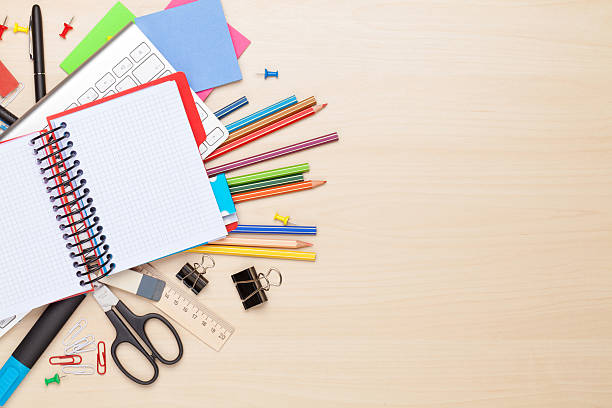 istock Blank notepad over school and office supplies 486284782