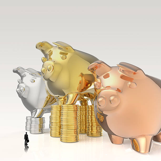 istock businessman looking at 3d piggy bank 486285669