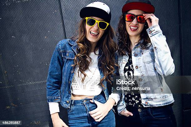 Young Beautiful Girls With Denim Suit In A Urban Background Stock Photo - Download Image Now