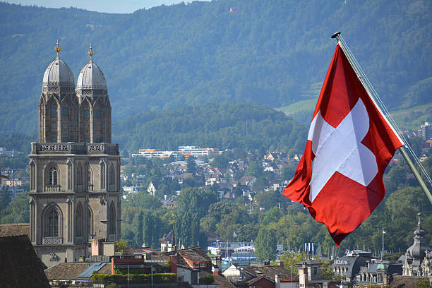 istock Grossmunster towers , with Swiss Flag on  the side 486285962