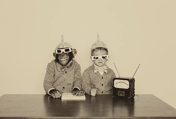 Connection A boy and his chimpanzee friend are looking to connect with other dimensions. ape photos stock pictures, royalty-free photos & images
