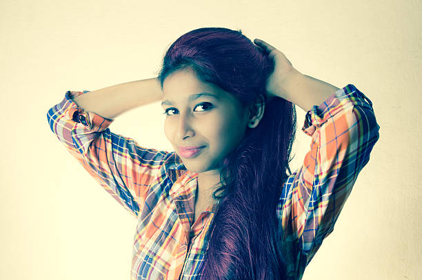 Young Woman With Long Hair in Black Pants and Top