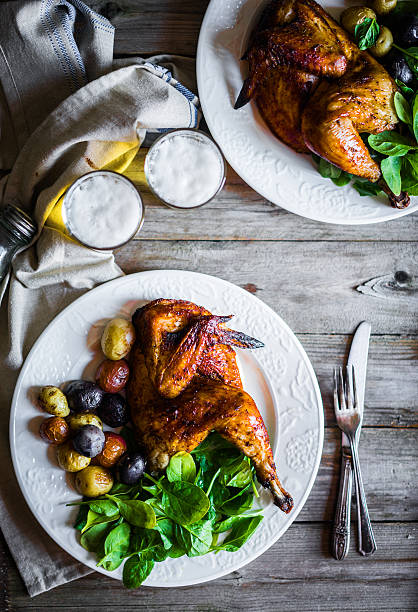 istock Roasted half chicken with potatoes and spinach 486286994