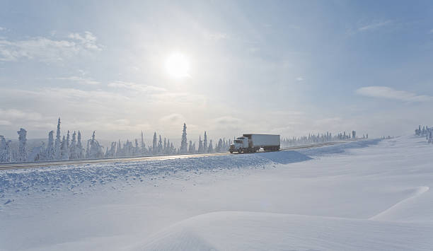 автоперевозка в удаленный wilderness winter - semi truck cargo container mode of transport horizontal стоковые фото и изображения