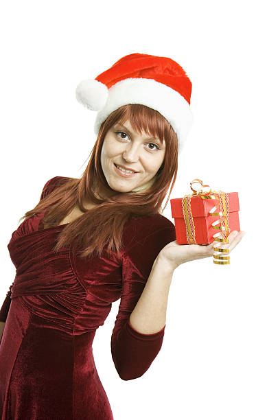 istock girl in santa hat with gift box 486287567