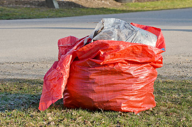 istock open red plastic rubbish bag sack in park 486289199