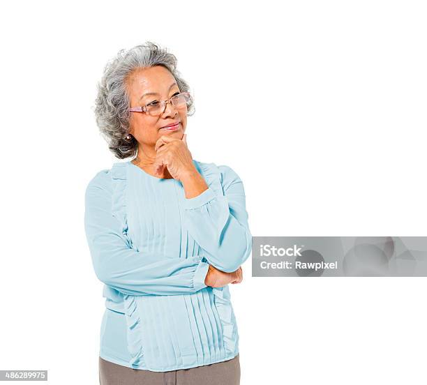 Smart Mature Asian Woman Thinking Stock Photo - Download Image Now - Senior Adult, Contemplation, White Background